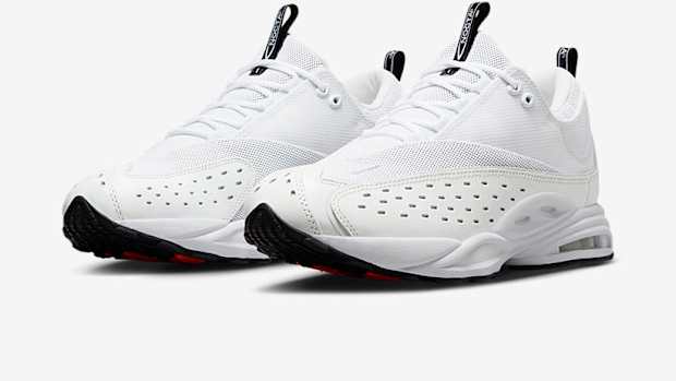 Side view of Drake's white and black NOCTA x Nike sneakers.
